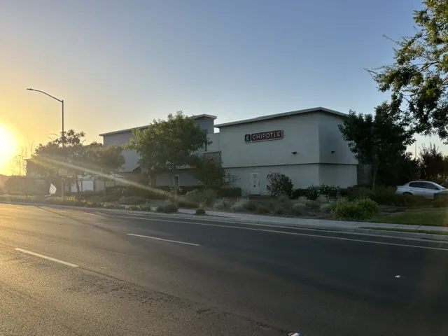 Herndon & Fowler retail center in Clovis, CA, with Chipotle building at sunrise